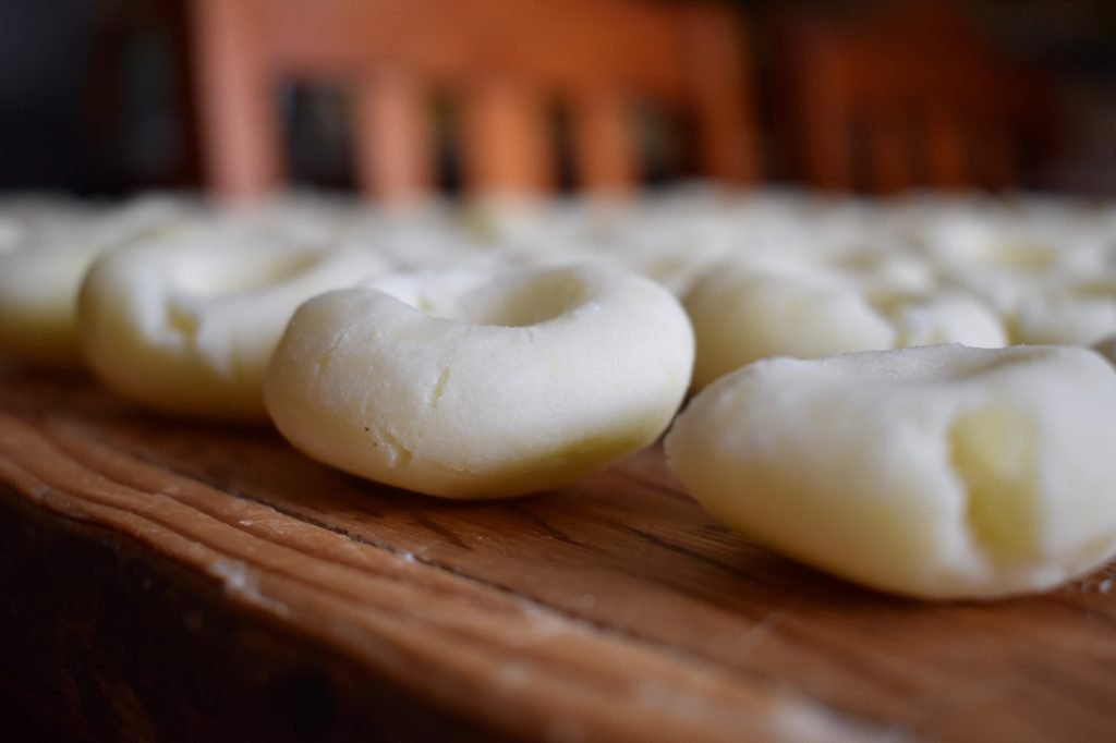 Dumplings lined on a pastry board